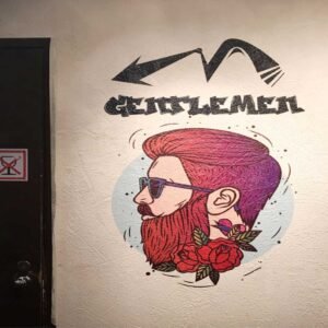 Wall print art mural on a mens room on a cafes wall
